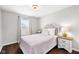 Charming bedroom features a neutral color palette and hardwood floors at 7128 English Oak Dr, McCordsville, IN 46055