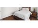 Comfortable bedroom featuring a plush bed with drawers and dark wood floors at 7128 English Oak Dr, McCordsville, IN 46055