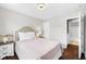 Comfortable bedroom features a neutral color palette and an ensuite bathroom at 7128 English Oak Dr, McCordsville, IN 46055