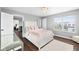 Bedroom featuring a plush bed, a chandelier, hardwood floors, and a window with exterior view at 7128 English Oak Dr, McCordsville, IN 46055