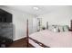 Comfortable bedroom with a four-poster bed and an ensuite bathroom at 7128 English Oak Dr, McCordsville, IN 46055