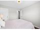 Light bedroom with a full bed and view to the hallway at 7128 English Oak Dr, McCordsville, IN 46055