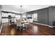 Cozy dining area adjacent to a modern kitchen with white cabinetry and lots of natural light at 7128 English Oak Dr, McCordsville, IN 46055