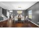 The bright dining room features stylish lighting, hardwood flooring, and a sophisticated design at 7128 English Oak Dr, McCordsville, IN 46055