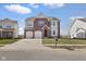 Attractive two-story home with a brick facade, two-car garage, and well-kept lawn, complete with a mailbox at 7128 English Oak Dr, McCordsville, IN 46055