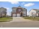 Charming two-story brick home with two-car garage and a well-maintained front yard, offering great curb appeal at 7128 English Oak Dr, McCordsville, IN 46055