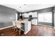 Modern kitchen featuring an island with seating, sleek countertops, and stainless steel appliances at 7128 English Oak Dr, McCordsville, IN 46055