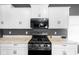 Close up on a modern kitchen featuring new appliances and a gas range at 7128 English Oak Dr, McCordsville, IN 46055