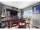 Finished basement featuring a custom wet bar, entertainment area, and natural light at 7128 English Oak Dr, McCordsville, IN 46055