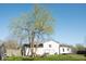 Backyard featuring a tree, a detached garage, and a swing set at 7838 Burr Oak Ct, Indianapolis, IN 46217