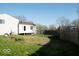 Backyard with a detached garage and an area for outdoor entertaining at 7838 Burr Oak Ct, Indianapolis, IN 46217