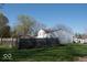 Large backyard with a wooden fence, providing ample space for recreation and a secure perimeter at 7838 Burr Oak Ct, Indianapolis, IN 46217