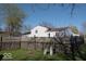 Fenced backyard featuring a well-maintained lawn, offering privacy and space for outdoor activities at 7838 Burr Oak Ct, Indianapolis, IN 46217