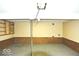 Spacious unfinished basement with wood paneling, neutral carpet, and support beams at 7838 Burr Oak Ct, Indianapolis, IN 46217
