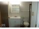 Functional bathroom with a vanity, medicine cabinet, toilet, and a shower with glass doors at 7838 Burr Oak Ct, Indianapolis, IN 46217