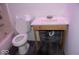 Bathroom featuring a classic toilet and rustic wood-framed vanity at 7838 Burr Oak Ct, Indianapolis, IN 46217