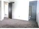 Spacious bedroom featuring a view of the ensuite bathroom with a glass-enclosed shower at 7838 Burr Oak Ct, Indianapolis, IN 46217