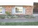 The house boasts well-kept flowerbeds in front at 7838 Burr Oak Ct, Indianapolis, IN 46217