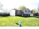 Charming home with a spacious front yard, mature trees, and a side-entry garage at 7838 Burr Oak Ct, Indianapolis, IN 46217