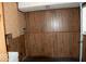 Functional laundry room area featuring durable paneled walls for a clean look at 7838 Burr Oak Ct, Indianapolis, IN 46217