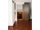 Hardwood flooring into hall with stairway in older home at 7838 Burr Oak Ct, Indianapolis, IN 46217
