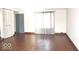 This room offers a blend of comfort and functionality, featuring hardwood floors, and ample natural light at 7838 Burr Oak Ct, Indianapolis, IN 46217