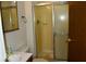 Bathroom features a shower with sliding glass doors, vanity with sink, and a toilet with fixtures at 7838 Burr Oak Ct, Indianapolis, IN 46217
