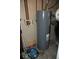 Utility room featuring a modern water heater with essential plumbing connections at 7838 Burr Oak Ct, Indianapolis, IN 46217