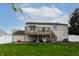 Home backyard with a wood deck, stairs, hammock, and grass lawn at 8231 N Chaucer Ct, Columbus, IN 47201