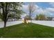 A fenced backyard featuring a manicured lawn, providing privacy and security for outdoor activities at 8231 N Chaucer Ct, Columbus, IN 47201