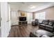 Cozy finished basement featuring a large TV, comfortable leather seating, and neutral paint tones at 8231 N Chaucer Ct, Columbus, IN 47201