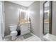 A tidy bathroom featuring a vanity with ample storage, a toilet, and neutral color scheme at 8231 N Chaucer Ct, Columbus, IN 47201