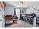 Fun bedroom with unique dinosaur-themed decorations, bunk beds, and natural light at 8231 N Chaucer Ct, Columbus, IN 47201