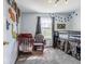 Bright bedroom with a playful dinosaur theme, a comfy rocking chair, and cozy carpeting at 8231 N Chaucer Ct, Columbus, IN 47201