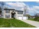 Attractive two-story home with a well-maintained lawn and a convenient two-car garage at 8231 N Chaucer Ct, Columbus, IN 47201