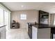 Open kitchen featuring an island, stainless steel appliances, and seamless access to the dining area at 8231 N Chaucer Ct, Columbus, IN 47201