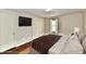 Staged bedroom features hardwood floors, closet and a window to provide natural light at 831 N 12Th St, Elwood, IN 46036