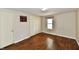 Bedroom features hardwood floors, a window, closet and fresh paint at 831 N 12Th St, Elwood, IN 46036