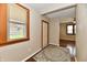 Inviting entryway featuring wood-look floors, neutral paint, and a decorative rug at 831 N 12Th St, Elwood, IN 46036