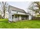 Charming two-story home featuring a covered porch, well-maintained lawn, and traditional architecture at 831 N 12Th St, Elwood, IN 46036