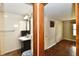 Hallway provides access to a bathroom with a sink and a view into the bedroom at 831 N 12Th St, Elwood, IN 46036