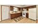 Kitchen with wooden cabinets and stainless steel sink next to the white door at 831 N 12Th St, Elwood, IN 46036