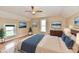 Virtual staging of a bedroom with wood floors, neutral colors, and three art pieces that enhance the space and aesthetic at 831 N 12Th St, Elwood, IN 46036