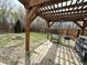 Relaxing backyard featuring a pergola with lights, fire pit, and outdoor grill at 8333 Sansa St, Indianapolis, IN 46113