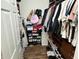 Walk-in closet with wood shelving, organized storage for shoes, clothes, and accessories at 8333 Sansa St, Indianapolis, IN 46113