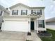 Charming two-story home featuring a well-maintained yard, a two-car garage, and classic curb appeal at 8333 Sansa St, Indianapolis, IN 46113