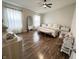 Serene primary bedroom with hardwood floors, lots of natural light, and neutral decor creating a tranquil atmosphere at 8333 Sansa St, Indianapolis, IN 46113