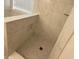 Modern shower with marble tile, a built-in niche and a stylish subway tile floor at 8333 Sansa St, Indianapolis, IN 46113