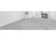 Attic room featuring neutral carpet, black railing and a window at 835 N Dearborn St, Indianapolis, IN 46201