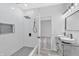 Newly remodeled bathroom with a tiled shower, modern fixtures, and dual sinks at 835 N Dearborn St, Indianapolis, IN 46201